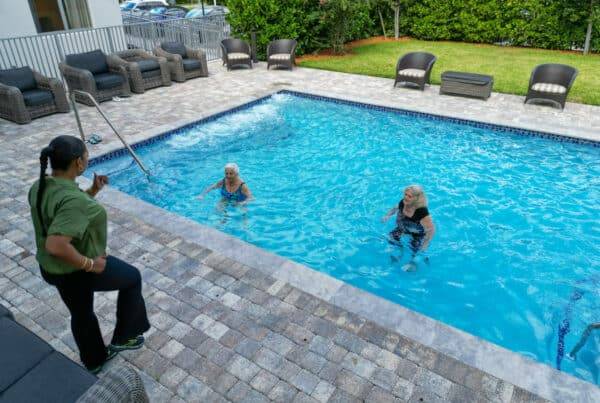 seniors exercising in assisted living pool in miami